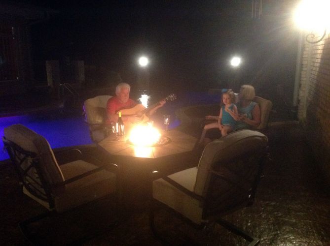 john jordan - with family around pool and firepit